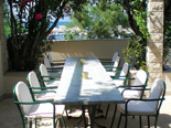 Outside terrace with table in holiday villa with pool in Mirca on Brac Croatia