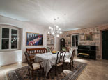 Dining area with a piano in the background at the exclusive rental villa in Dubrovnik