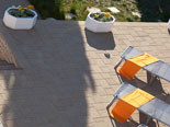 Sun deck with sun beds in front of the villa in Šibenik region