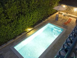 Pool area of the villa by night 