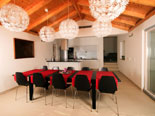 Dining room in the modern Dalmatian seafront villa with pool on Brac Island in Split region