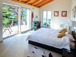 Bedroom in the modern Dalmatian seafront villa with pool on Brac Island in Split region