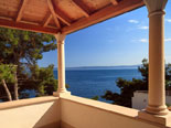 Terrace and the view from the modern Dalmatian seafront villa with pool on Brac Island in Split region