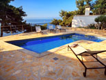 Outside terrace in the modern Dalmatian seafront villa with pool on Brac Island in Split region