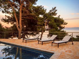 Outside of the modern Dalmatian seafront villa with pool on Brac Island in Split region