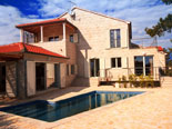 Outside of the modern Dalmatian seafront villa with pool on Brac Island in Split region