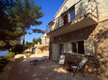 Outside of the seafront Dalmatian villa with pool on Brac Island in Split region