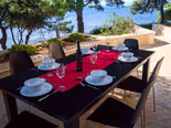 Outside dining terrace in front of the Dalmatian villa with pool on Brac Island in Split region