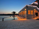 Pool area of the luxury seafront villa on Dalmatian island of Korčula during sunset