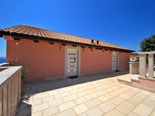 Big terrace in front of the entrance to the top floor bedrooms of this villa for rent on the Korcula island