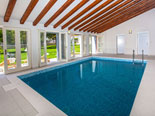 Indoor swimming pool is located in northern part of the garden