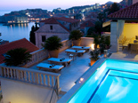 The white stone luxury villa with view at  Dubrovnik at dusk