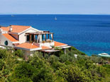 The villa is located on the edge of the sea