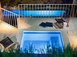 Jacuzzi and the pool by night in this design villa in Dubrovnik