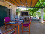 Dining table on terrace with BBQ 