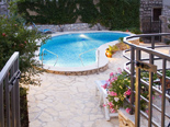 The pool area in traditional Dalmatian style holiday villa in Milna on Brac island in Croatia