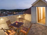 The upper terrace in Dalmatian traditional style holiday villa in Milna on Brac island in Croatia