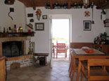 Traditionally decorated dining area with fire place in the house for rent on Brač Island