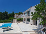 Pool area in Dalmatian stone holiday rental villa in Sumartin on Brač Island 