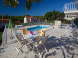 Pool area in Dalmatian stone holiday rental villa in Sumartin on Brač Island 