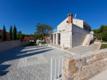 Outside of the Dalmatian stone holiday rental villa in Sumartin on Brač Island 