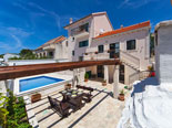 Pool and leisure area in four star holiday rental villa in Povlja on Brač Island in Dalmatia