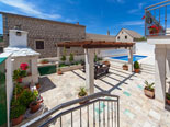 Pool and leisure area in four star holiday rental villa in Povlja on Brač Island in Dalmatia