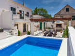 Pool and leisure area in four star holiday rental villa in Povlja on Brač Island in Dalmatia