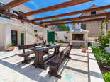 Outside dining with BBQ in four star holiday rental villa in Povlja on Brač Island in Dalmatia