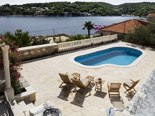 The view on the pool and the bay in Dalmatian holiday villa for rent in Sumartin on Brac in Split region