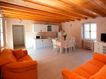 Another view on dining room, living room and kitchen in background in holiday house for rent in Omiš