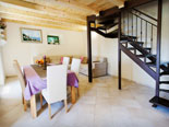 Dining room, living room and the stairs for upper floor in stone rental house in Dubrovnik