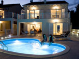 Modern villa with pool in Sumartin on Brac island Dalmatia Croatia by night