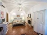 Master suite with fireplace and en-suite bathroom with shower on the ground floor in this Dubrovnik villa 