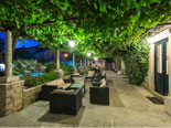 View from the east on courtyard dining and lounge area in this villa in Dubrovnik by night